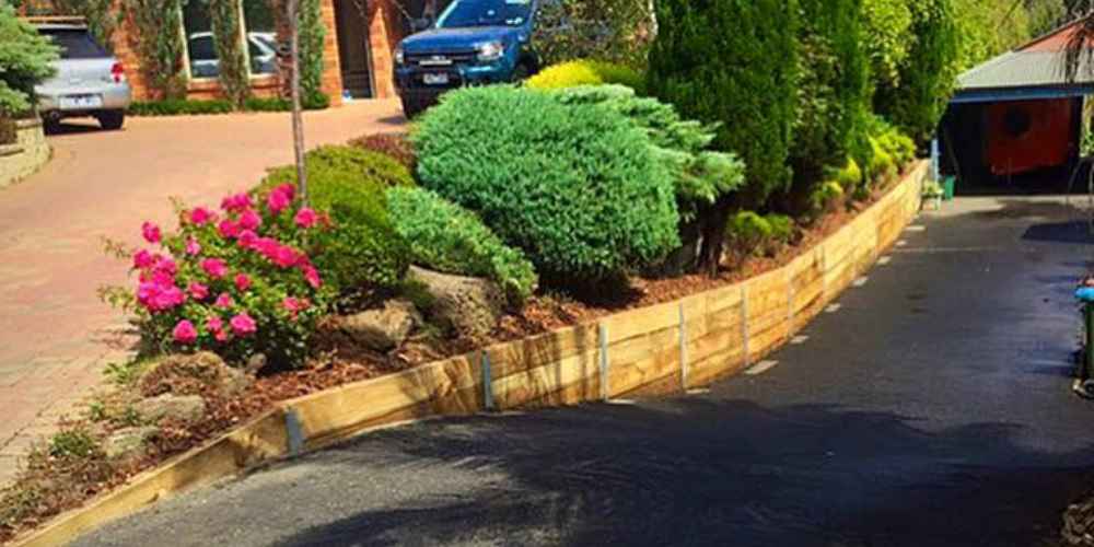 Retaining walls and landscape should they be together - Hammer Excavation