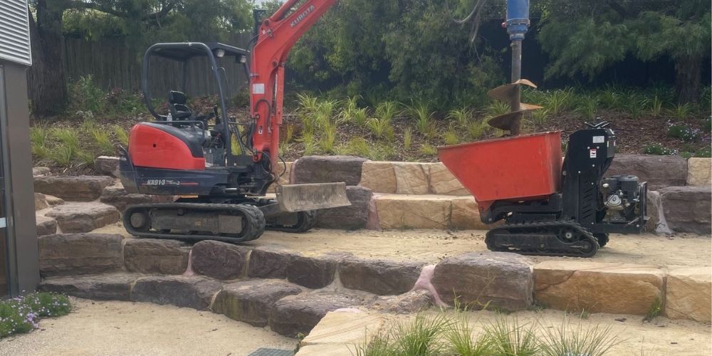 landscaping a sloped backyard - Hammer Excavation